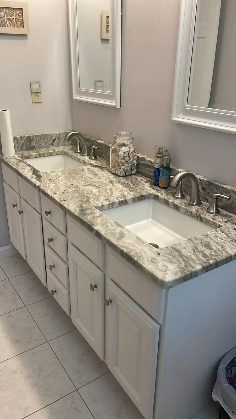 Clean granite double-sink bathroom vanity after cleaning in Clinton, MA