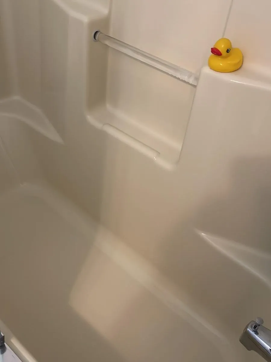 Shower surround wall after stain removal in Clinton, MA — clean, even finish