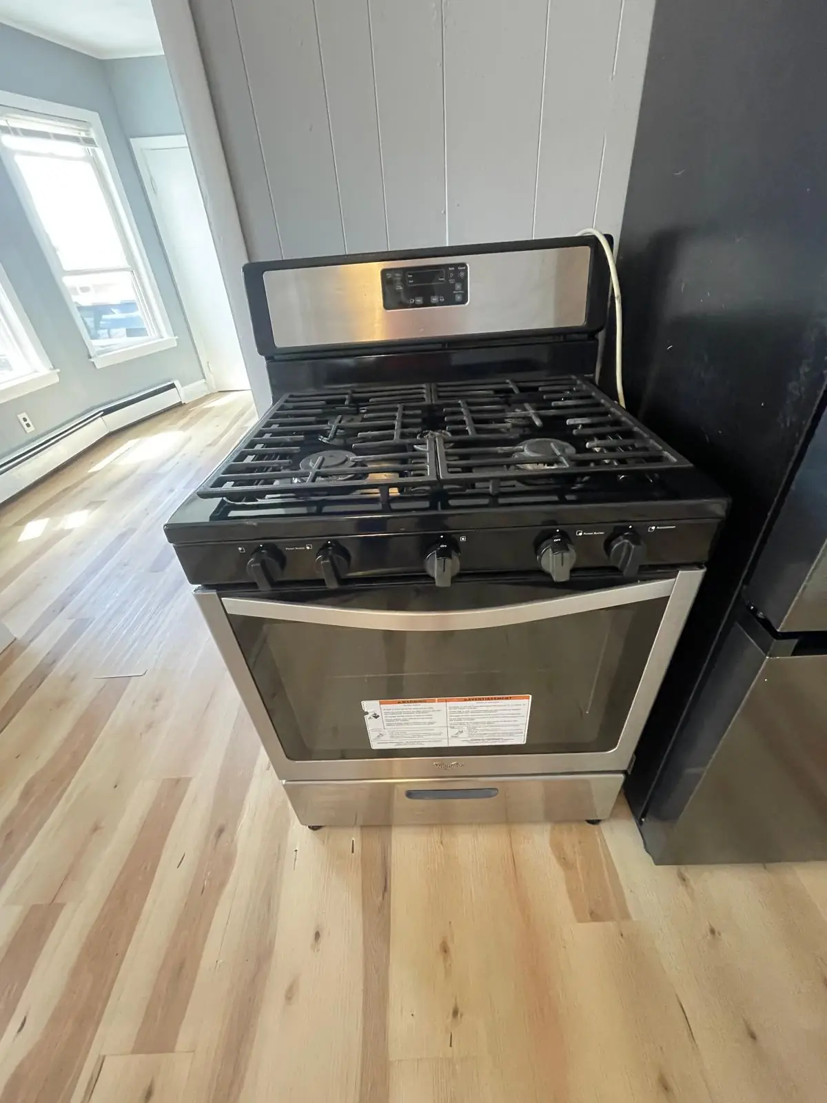 Clean black gas stove in a kitchen after cleaning in Clinton, MA