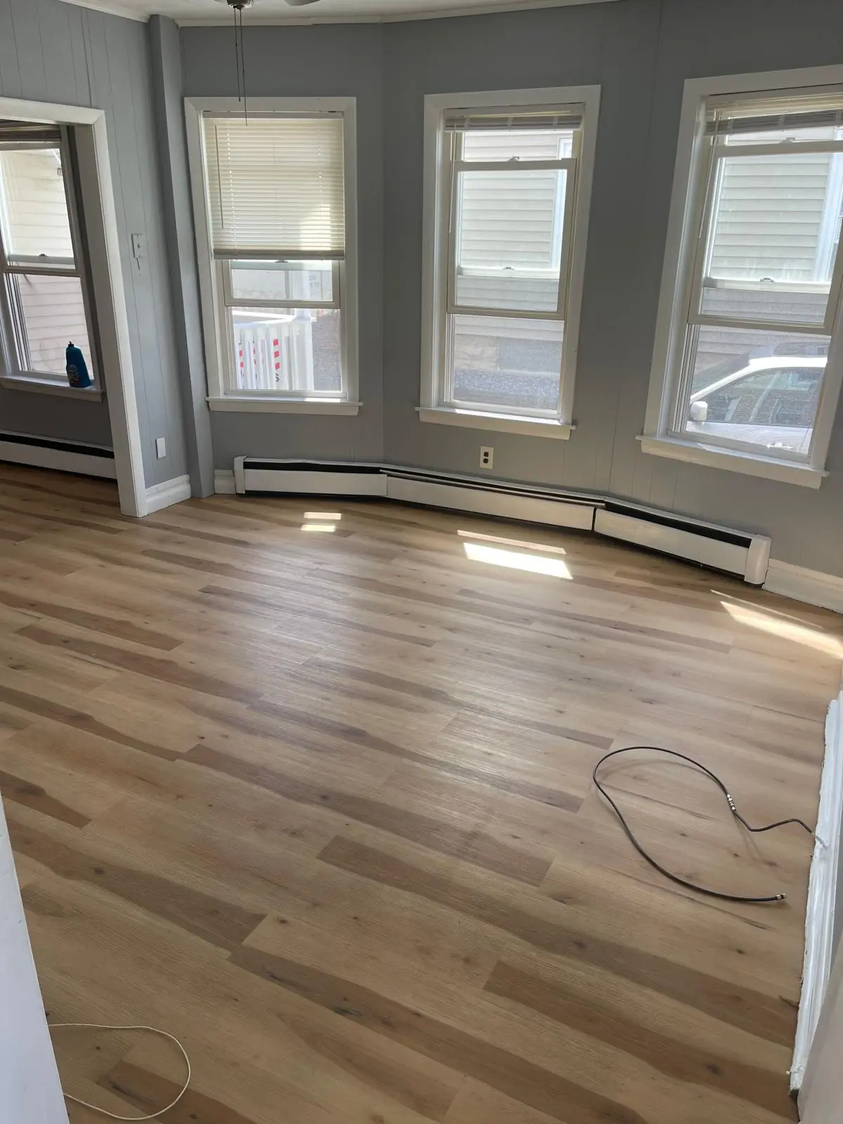 Clean hardwood floor in a living room after cleaning in Clinton, MA